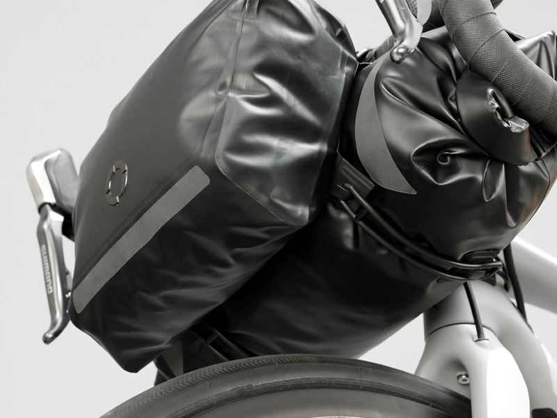 Road Accessory Pouch for easy access, featuring 'Fast-Fix' straps for secure attachment, large reflective area, and lightweight construction.
