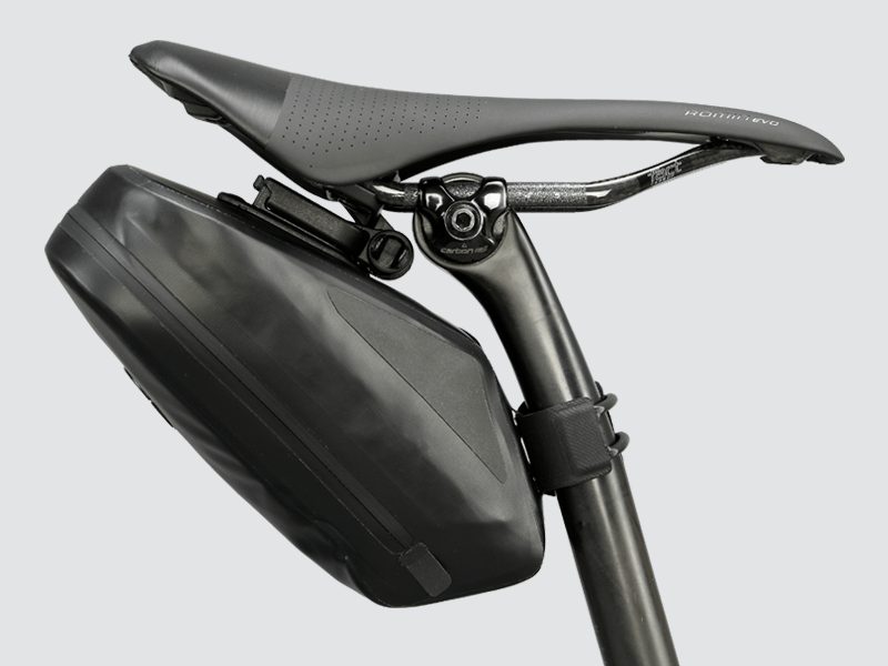 Road Saddle Bag - Large designed for easy access to spares and bulkier gear, featuring quick release buckle, 'Fast-Fix' strap system, lightweight construction, and reflective details for visibility.