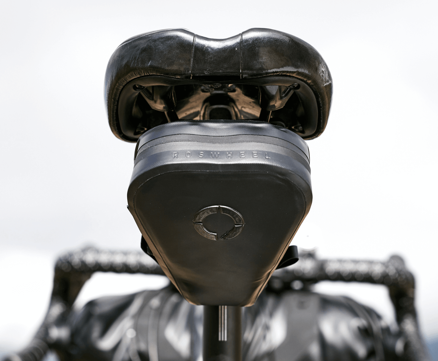 Road Saddle Bag - Small designed for easy access to spares and gear, featuring quick release buckle, 'Fast-Fix' strap system, and lightweight construction with reflective details.