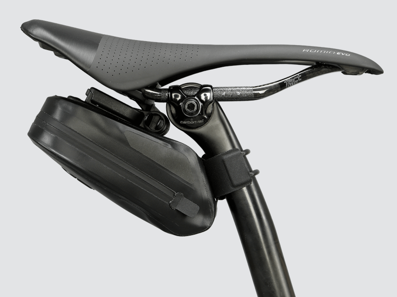 Road Saddle Bag - Small designed for easy access to spares and gear, featuring quick release buckle, 'Fast-Fix' strap system, and lightweight construction with reflective details.