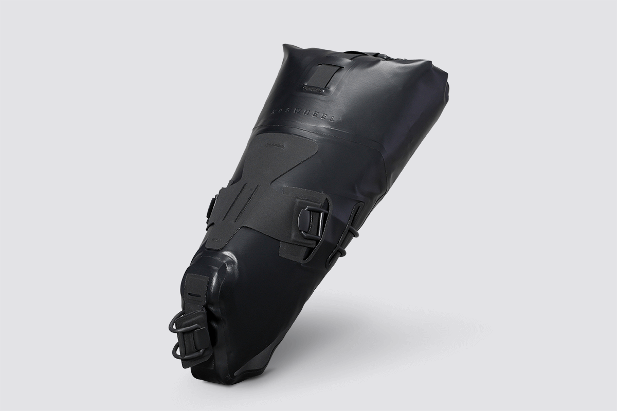 Road Seat Pack Small designed for fast rides, featuring 'Fast-Fix' strap system for secure attachment, lightweight construction, and large reflective areas for visibility.