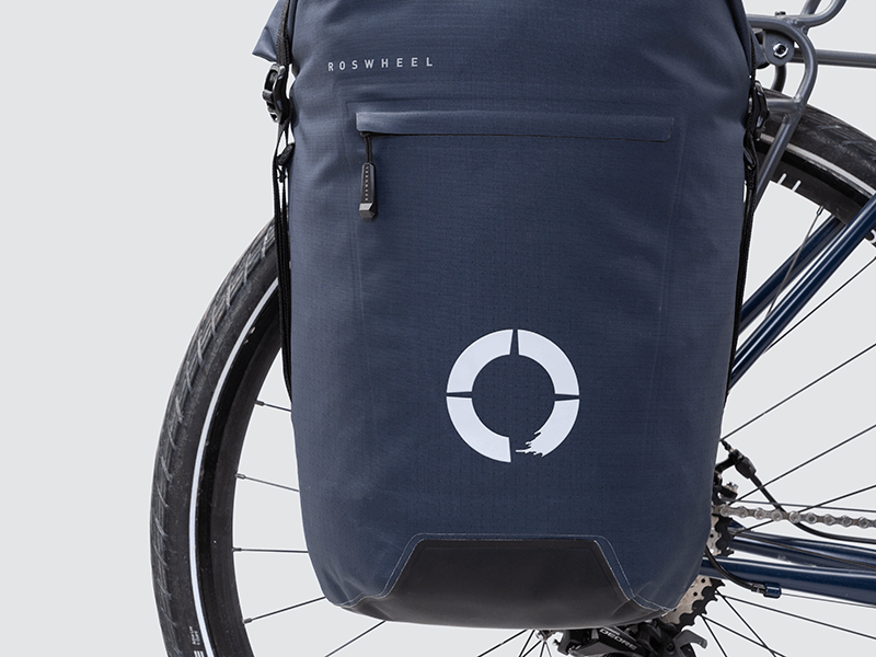 Waterproof Tour pannier bags (40L pair) with quick-tighten closure and reflective features for long-distance touring.