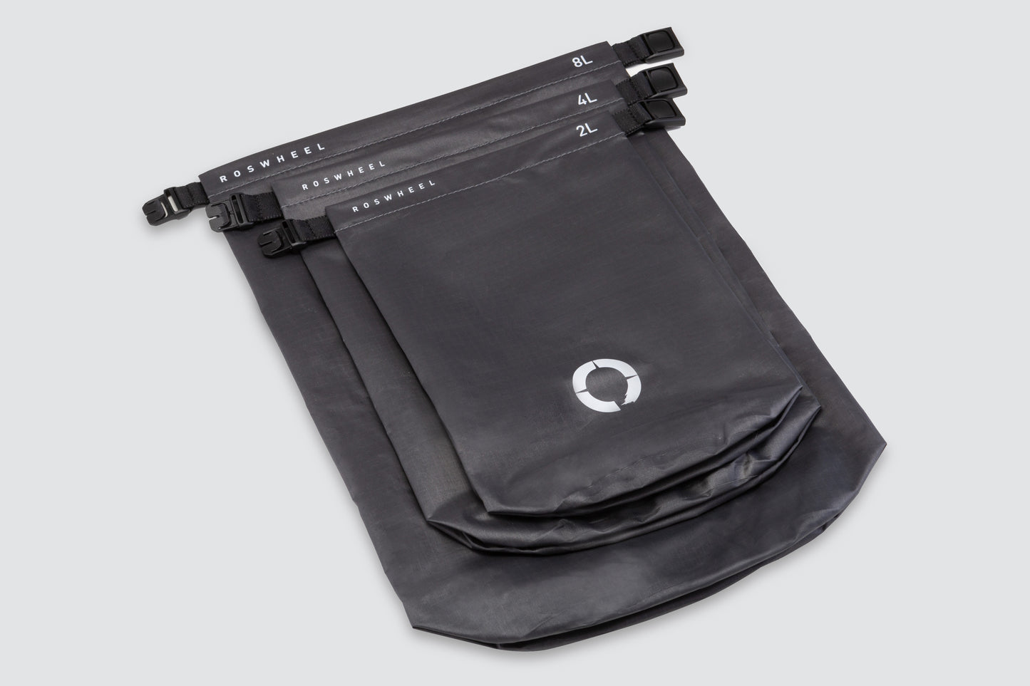 Set of three waterproof roll top sacks (2L, 4L, 8L) for organizing gear, featuring lightweight and durable construction.