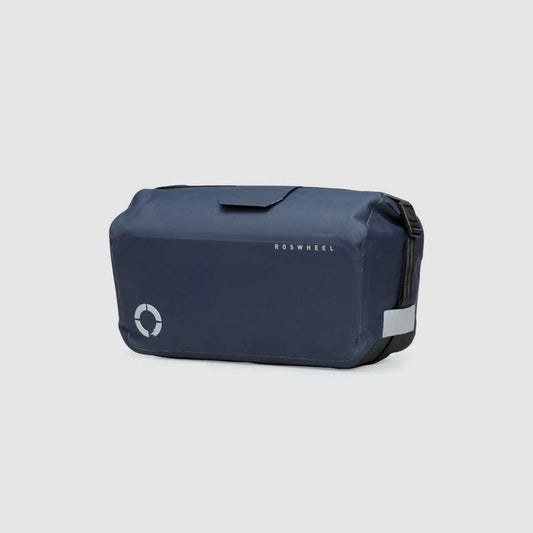 Waterproof Tour trunk bag with integrated attachment, reflective details, and protective base for secure storage.