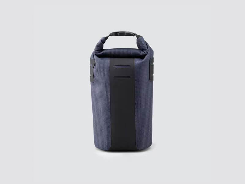 Off-Road Bottle Pouch designed to securely hold a large bottle or snacks, featuring roll top for weather protection and durable fabric for outdoor use.