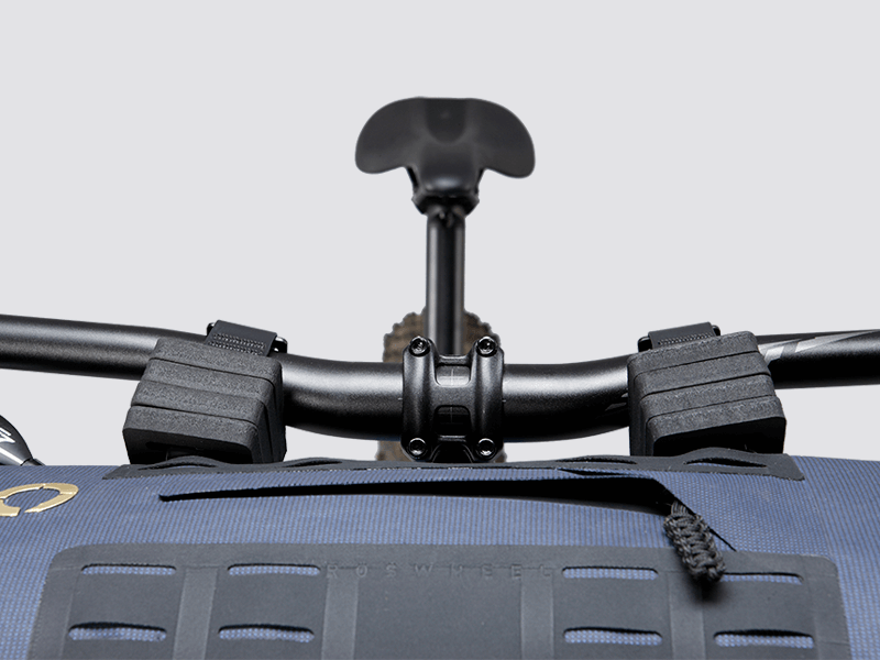 Off-Road Handlebar Bag Large designed for bulky gear, featuring extensive M.O.L.L.E. system, durable waterproof fabric, and internal pocket for secure organization.