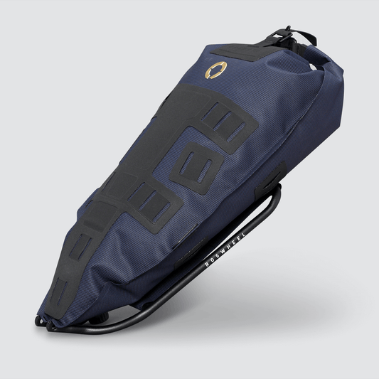 Off-Road Seat Pack Medium designed for weekend adventures, featuring waterproof construction, M.O.L.L.E. attachment system, and a stable adjustable rack for secure fitting.