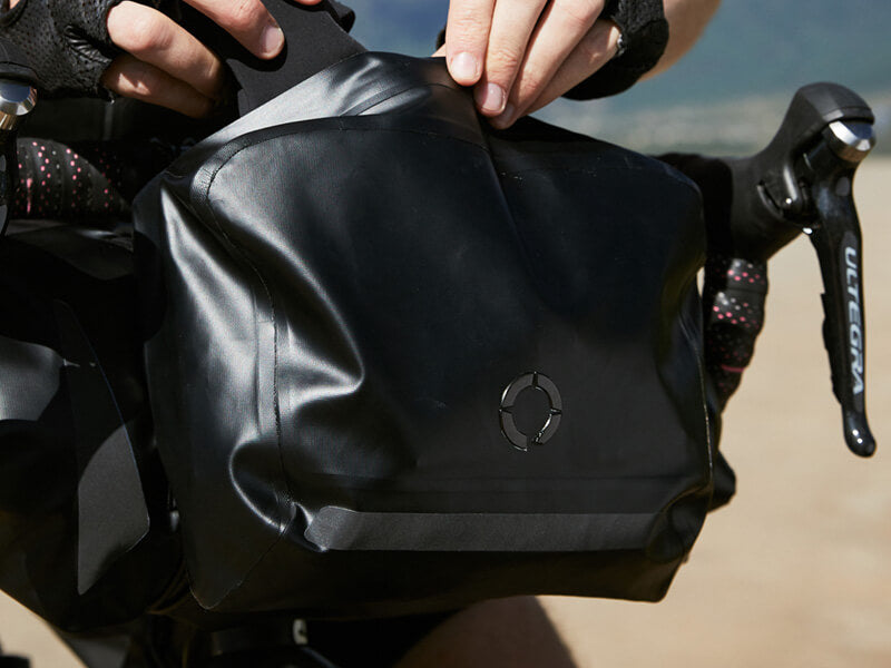 Road Accessory Pouch for easy access, featuring 'Fast-Fix' straps for secure attachment, large reflective area, and lightweight construction.