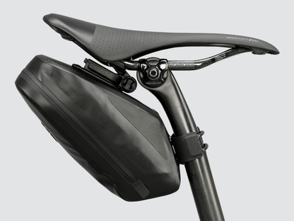 Road Saddle Bag - Large designed for easy access to spares and bulkier gear, featuring quick release buckle, 'Fast-Fix' strap system, lightweight construction, and reflective details for visibility.