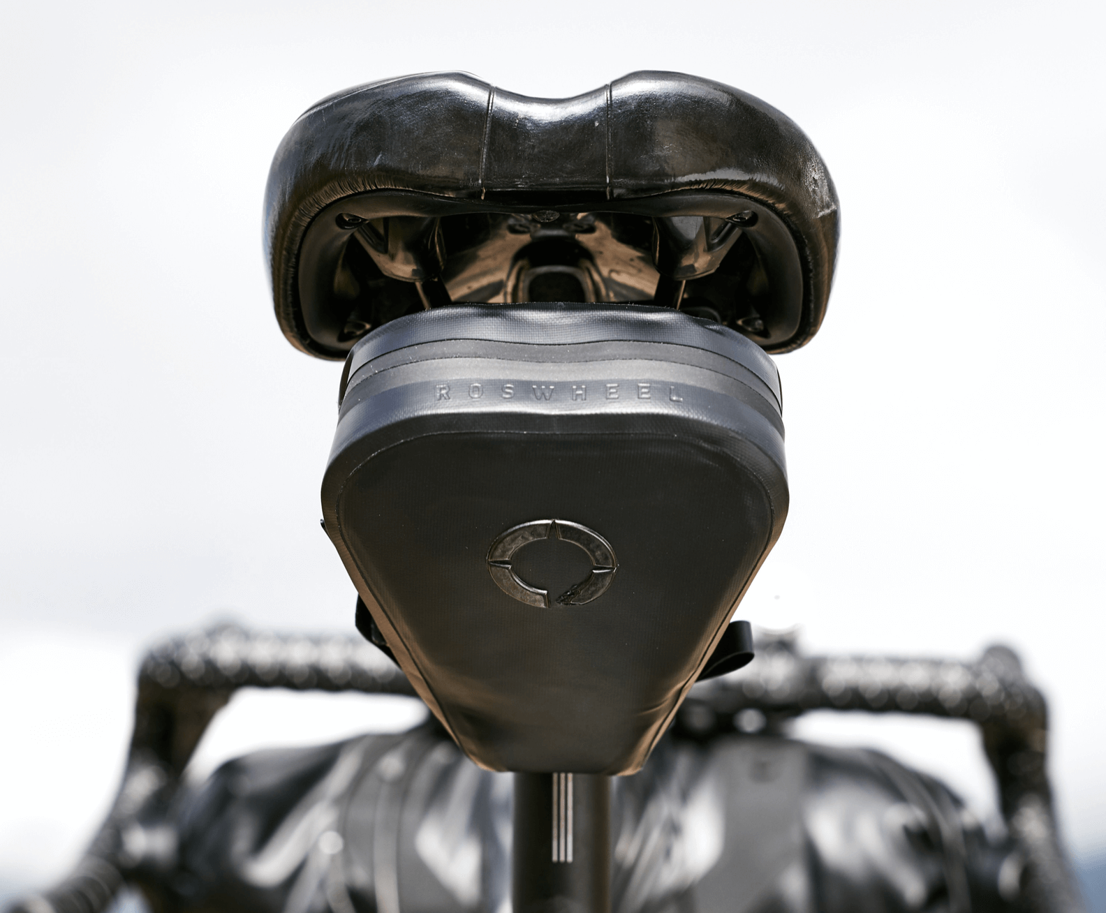 Road Saddle Bag - Small designed for easy access to spares and gear, featuring quick release buckle, 'Fast-Fix' strap system, and lightweight construction with reflective details.