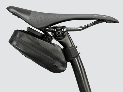 Road Saddle Bag - Small designed for easy access to spares and gear, featuring quick release buckle, 'Fast-Fix' strap system, and lightweight construction with reflective details.