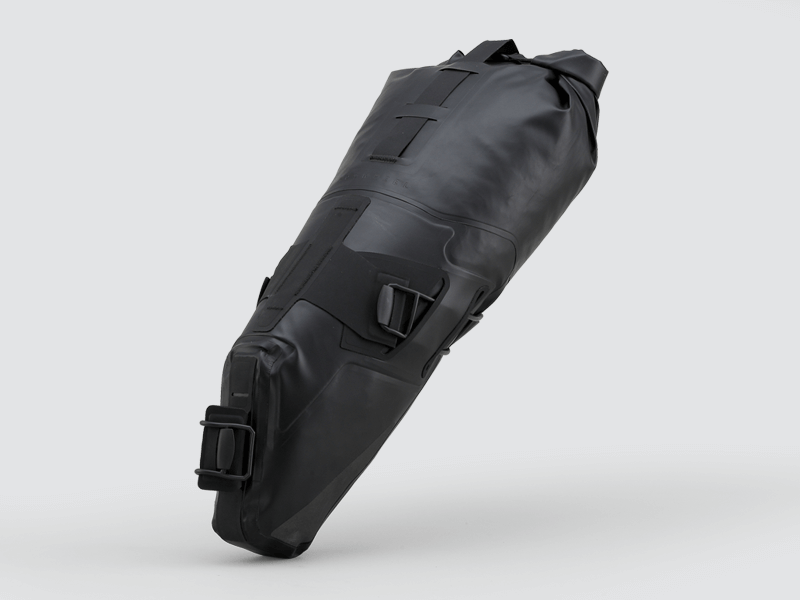 Road Seat Pack Medium designed for convenience and secure attachment, featuring 'Fast-Fix' strap system, lightweight construction, and large reflective areas for enhanced visibility.