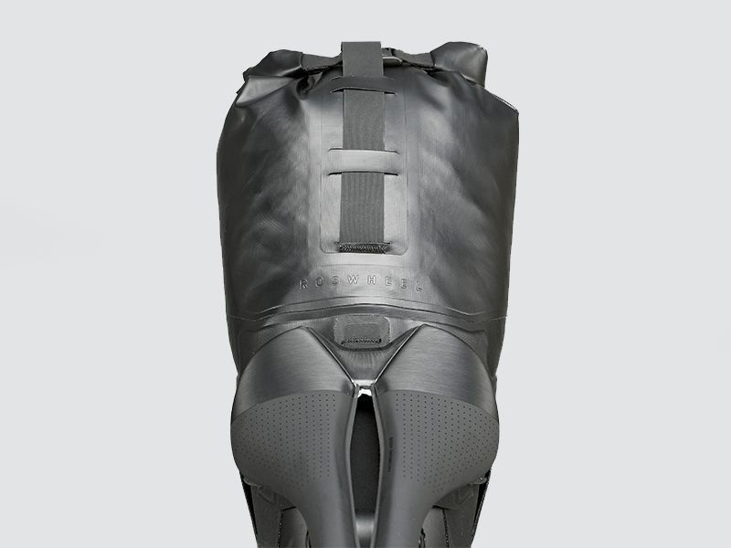 Road Seat Pack Medium designed for convenience and secure attachment, featuring 'Fast-Fix' strap system, lightweight construction, and large reflective areas for enhanced visibility.