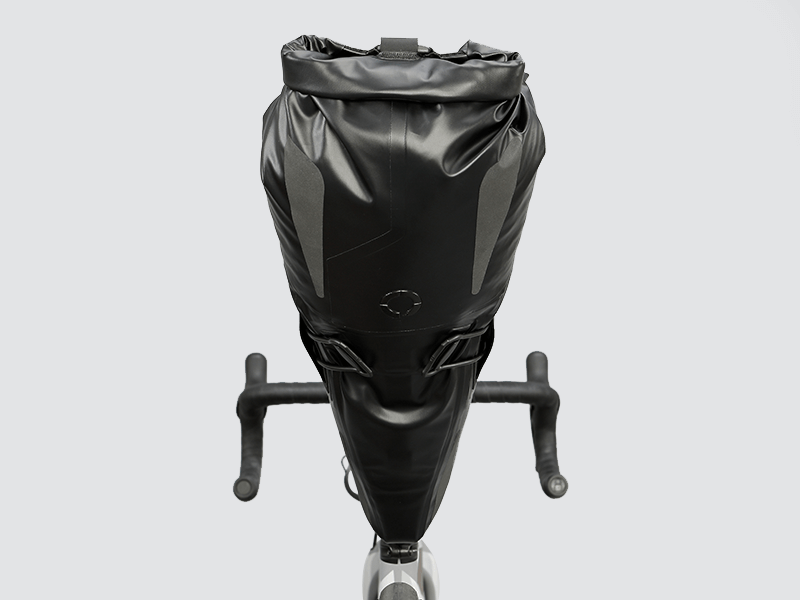 Road Seat Pack Medium designed for convenience and secure attachment, featuring 'Fast-Fix' strap system, lightweight construction, and large reflective areas for enhanced visibility.