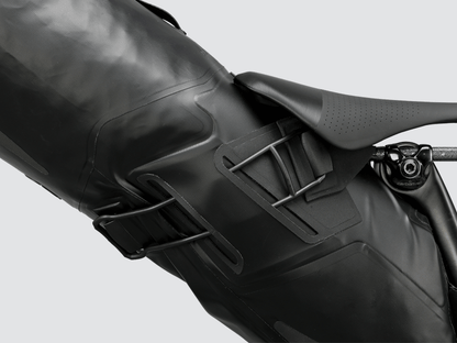 Road Seat Pack Medium designed for convenience and secure attachment, featuring 'Fast-Fix' strap system, lightweight construction, and large reflective areas for enhanced visibility.