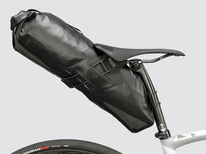 Road Seat Pack Medium designed for convenience and secure attachment, featuring 'Fast-Fix' strap system, lightweight construction, and large reflective areas for enhanced visibility.