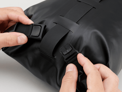 Road Seat Pack Small designed for fast rides, featuring 'Fast-Fix' strap system for secure attachment, lightweight construction, and large reflective areas for visibility.