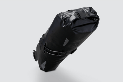 Road Seat Pack Small designed for fast rides, featuring 'Fast-Fix' strap system for secure attachment, lightweight construction, and large reflective areas for visibility.