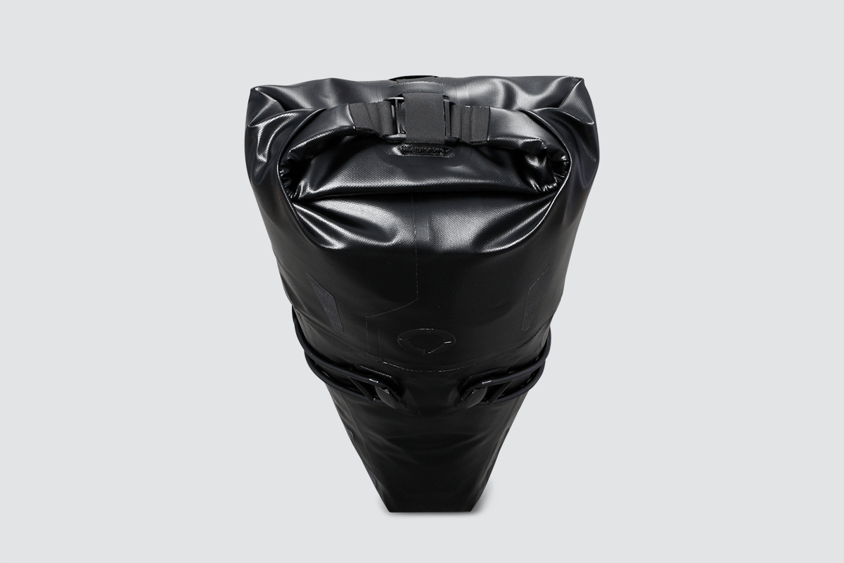 Road Seat Pack Small designed for fast rides, featuring 'Fast-Fix' strap system for secure attachment, lightweight construction, and large reflective areas for visibility.