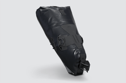 Road Seat Pack Small designed for fast rides, featuring 'Fast-Fix' strap system for secure attachment, lightweight construction, and large reflective areas for visibility.