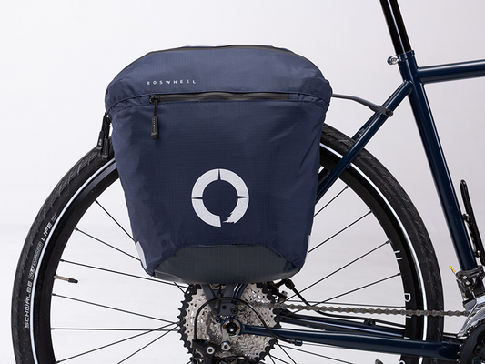Water-resistant Tour Lightweight Pannier designed for touring, featuring a semi-rigid structure and flexible attachment system for secure fitting.