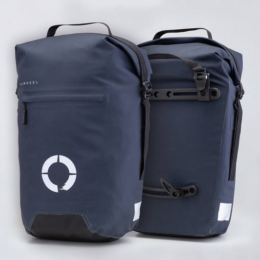 Waterproof Tour pannier bags (40L pair) with quick-tighten closure and reflective features for long-distance touring.