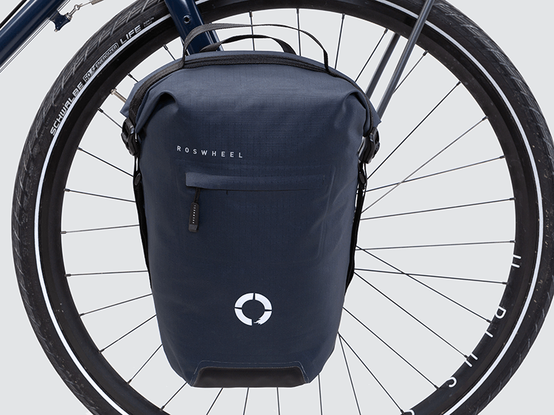 Waterproof Tour pannier bags (20L pair) with quick-tighten closure and reflective details for long-distance touring.