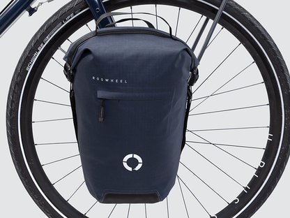 Waterproof Tour pannier bags (20L pair) with quick-tighten closure and reflective details for long-distance touring.