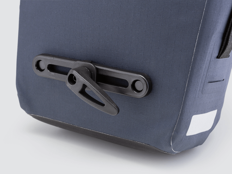 Waterproof Tour pannier bags (20L pair) with quick-tighten closure and reflective details for long-distance touring.