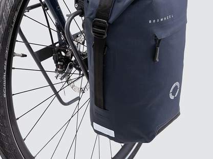 Waterproof Tour pannier bags (20L pair) with quick-tighten closure and reflective details for long-distance touring.