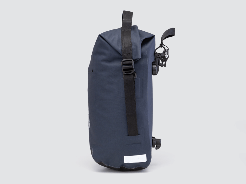 Waterproof Tour pannier bags (20L pair) with quick-tighten closure and reflective details for long-distance touring.