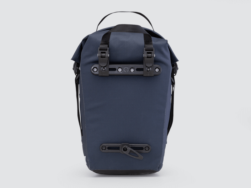 Waterproof Tour pannier bags (20L pair) with quick-tighten closure and reflective details for long-distance touring.
