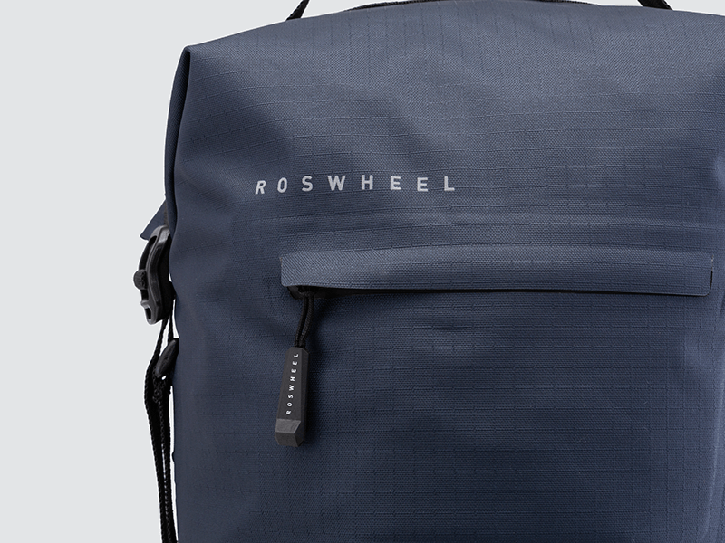 Waterproof Tour pannier bags (20L pair) with quick-tighten closure and reflective details for long-distance touring.