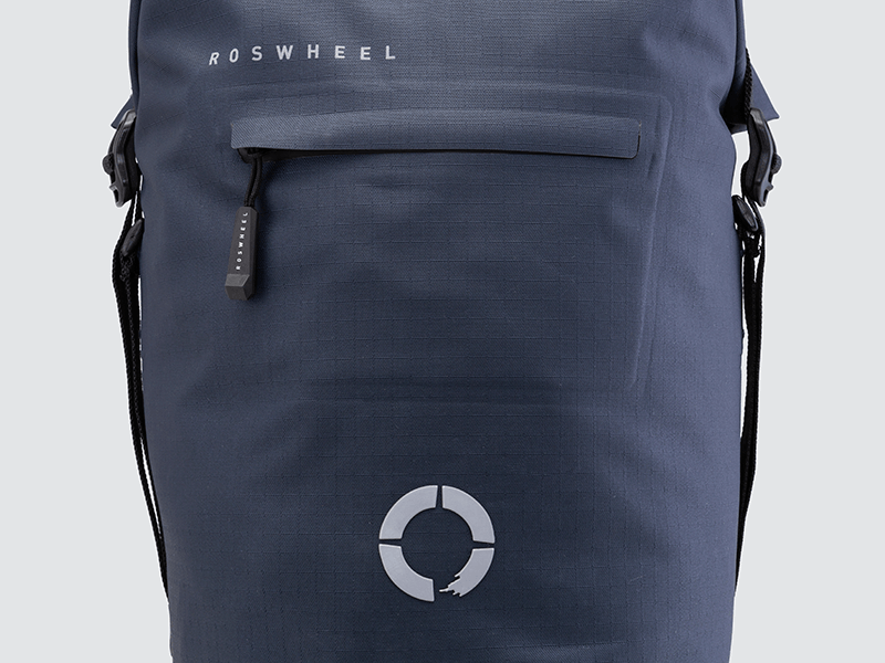 Waterproof Tour pannier bags (20L pair) with quick-tighten closure and reflective details for long-distance touring.
