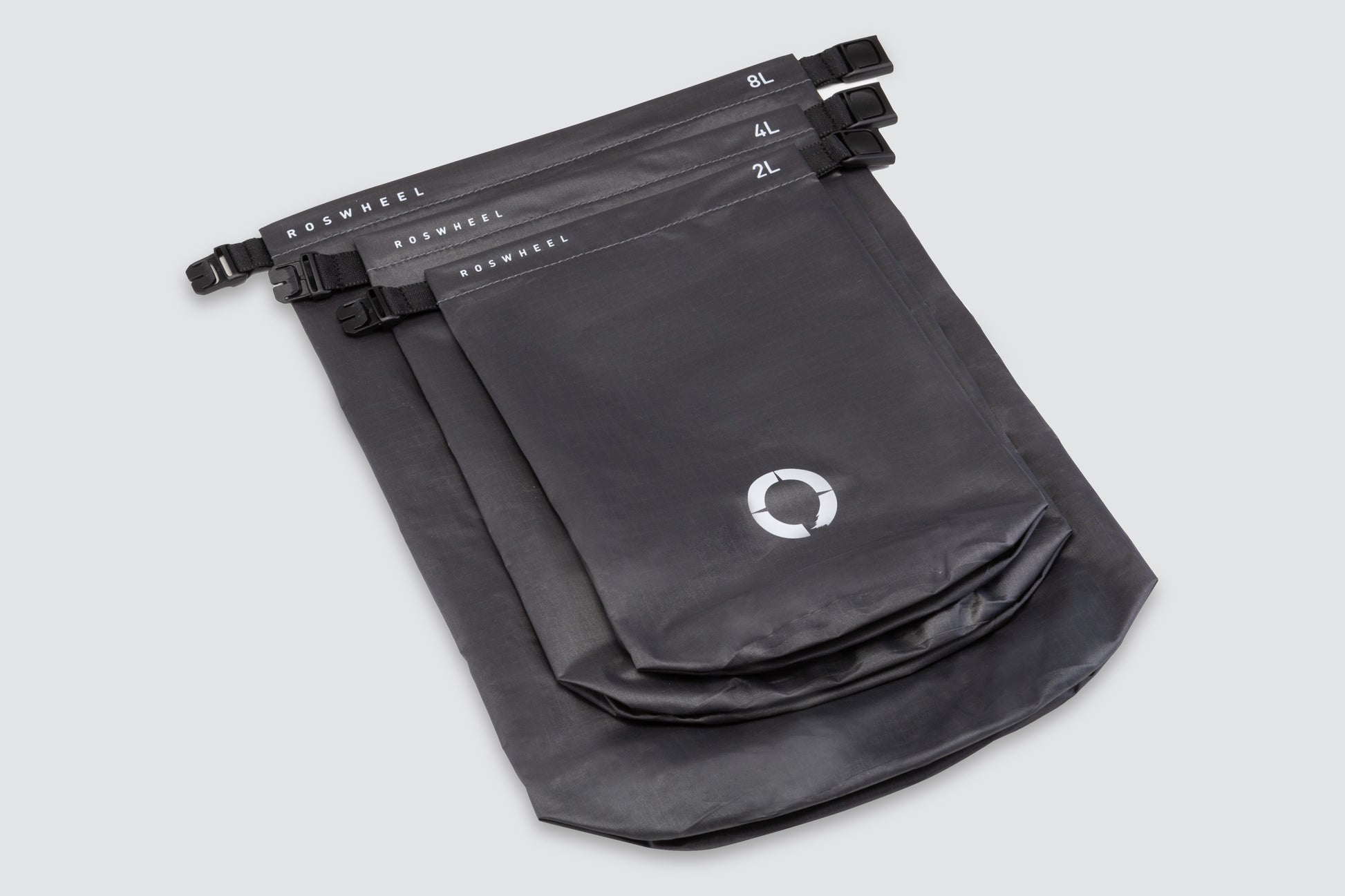 Set of three waterproof roll top sacks (2L, 4L, 8L) for organizing gear, featuring lightweight and durable construction.