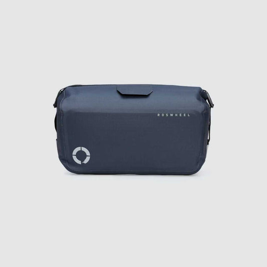 Waterproof Tour trunk bag with integrated attachment, reflective details, and protective base for secure storage.